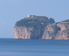 A picture of a lighthouse on a cliff